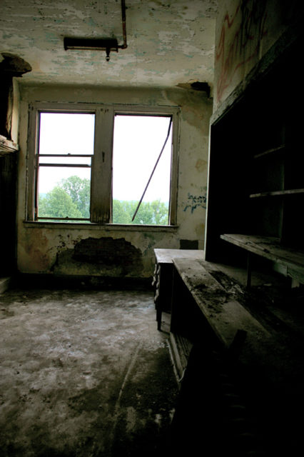 Empty desk in a decrepit room