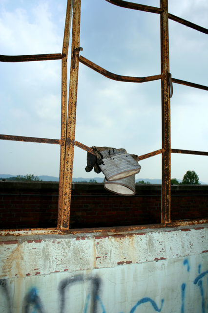 Gloves hanging on a fence