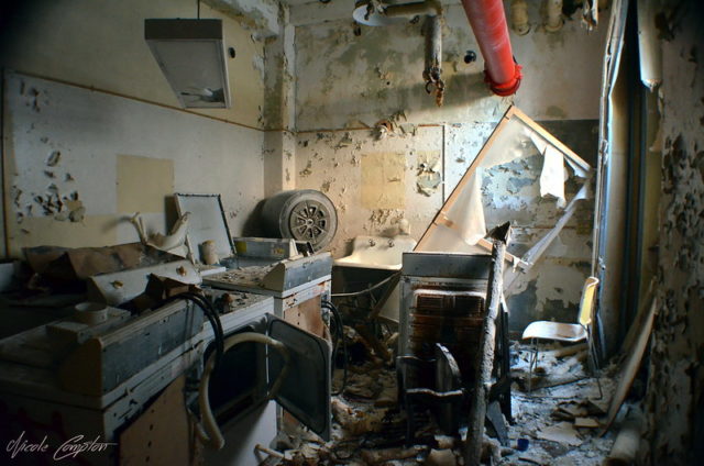 Office filled with broken furniture and debris