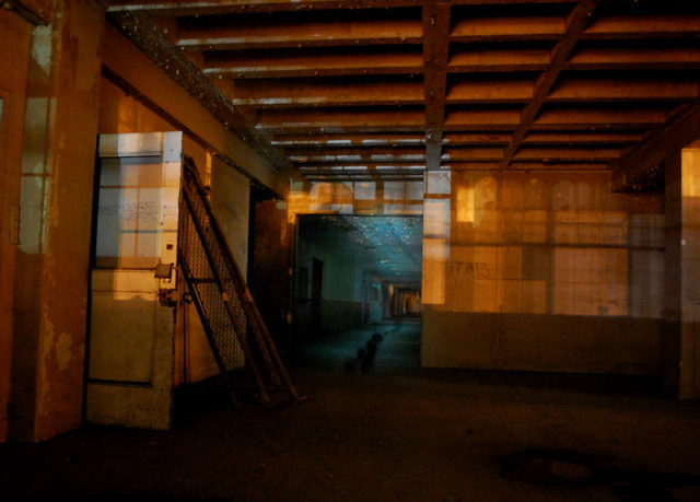 Large room leading to a darkened hallway at the Lincoln Heights Jail