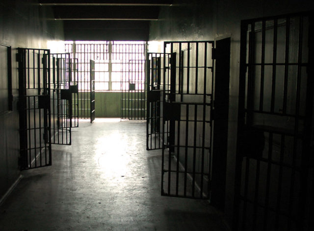 Hallway with open jail cells