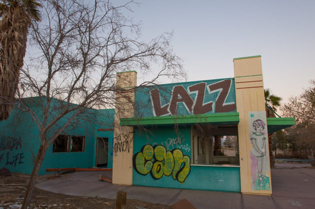 Blue building covered in graffiti