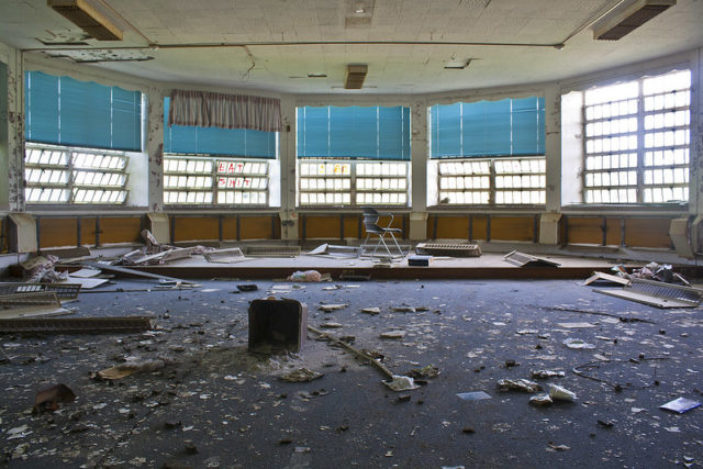 Large room littered in debris at the Hudson River State Hospital