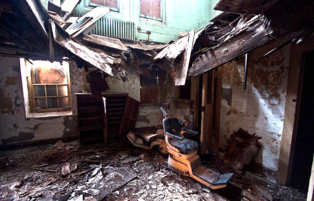 Chair beneath a collapsed roof at the Hudson River State Hospital