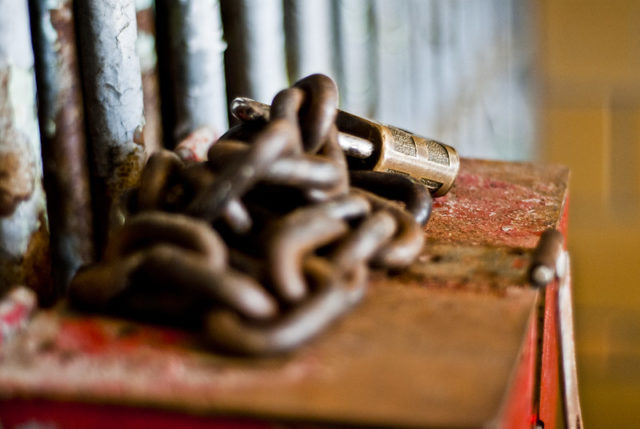 Rusty chains resting atop a red box