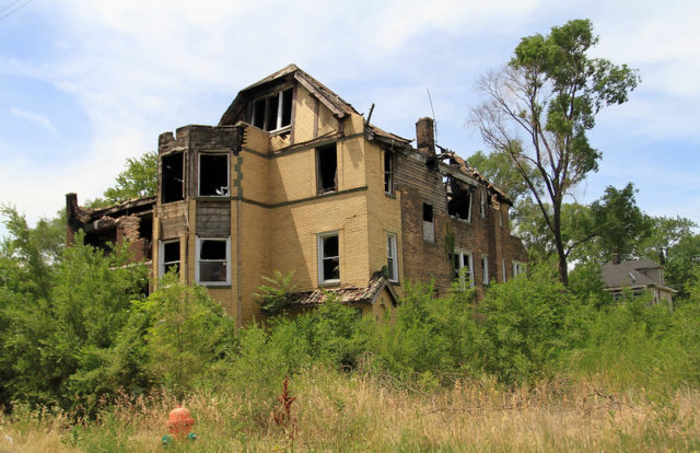 Yellow brick home falling apart