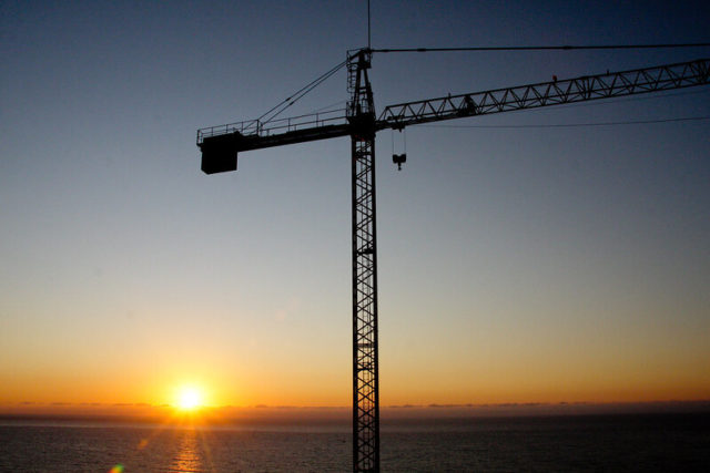 Construction crane at sunset