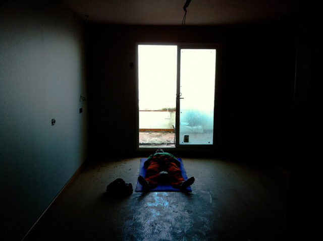 Man lying on the group of a Algarrobico Hotel room