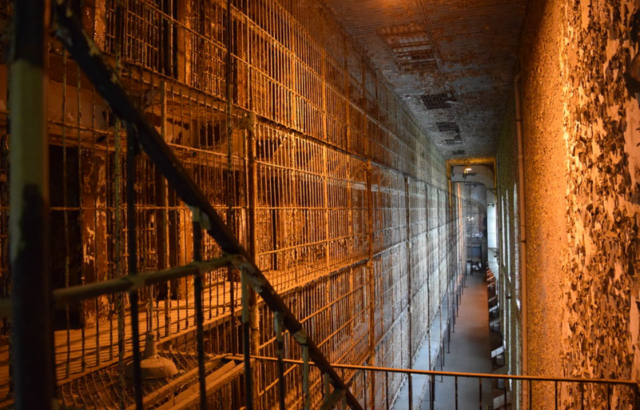 Dimly-lit prison cells