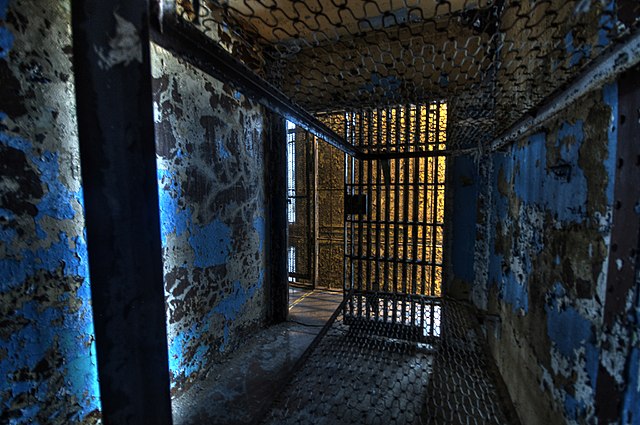 Interior of a darkened prison cell