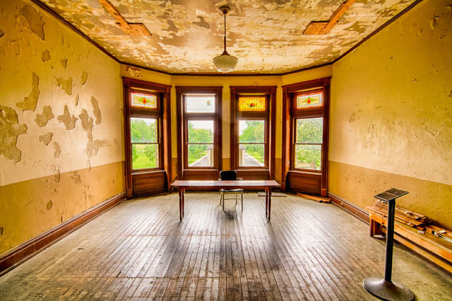 Desk and chair in the middle of a large room