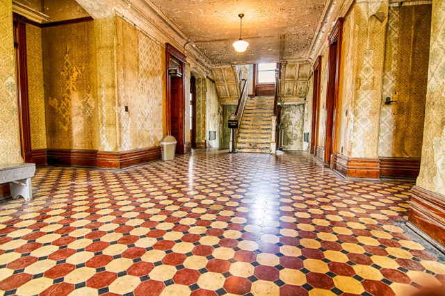 Large room with hallways and a staircase