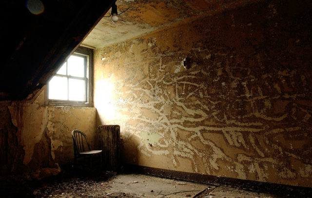 Dimly-lit room at the Ellis Island Immigrant Hospital