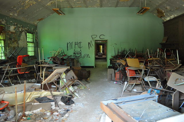 Room filled with overturned chairs