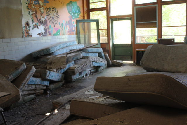 Mattresses stacked against a wall