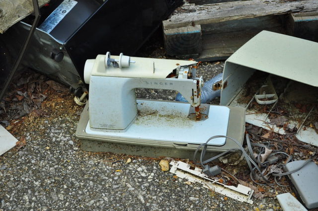 Blue sewing machine on the ground