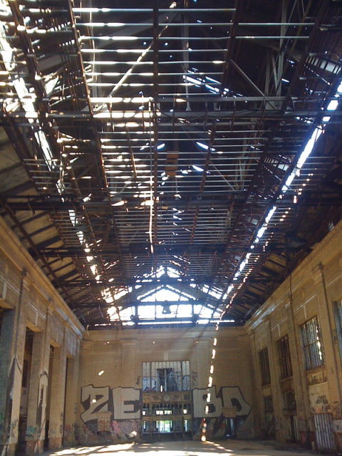 graffitied walls and broken roof of Michigan Central Station 