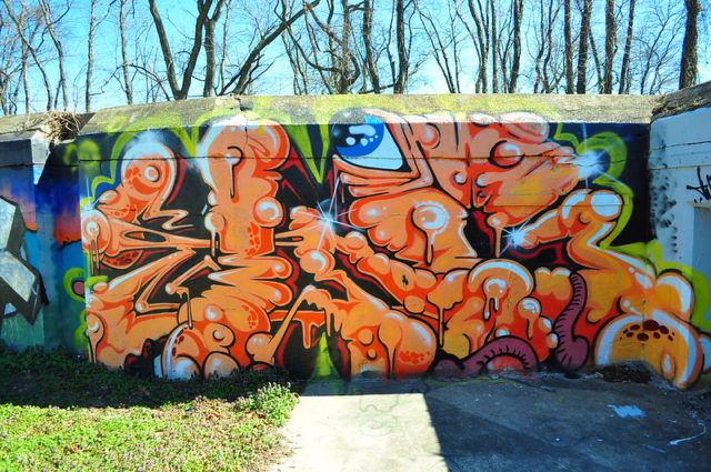 Orange octopus graffiti on a wall