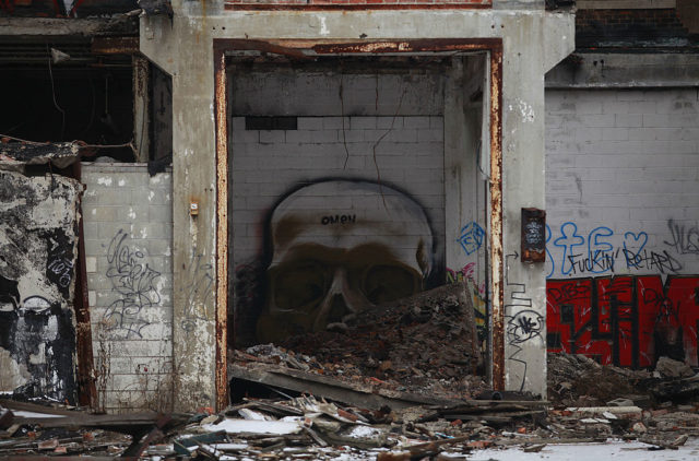 Skull graffiti through a doorway