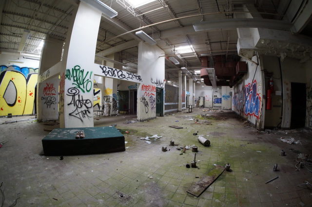 Empty room with graffiti-covered walls