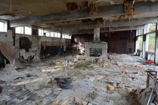 Fireplace in the middle of a decaying room