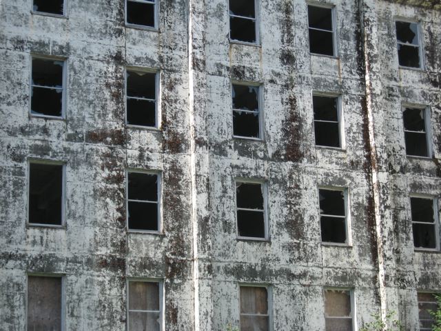 Broken windows on the exterior of the Buckner Building