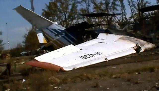 Airplane wing lying on the grass