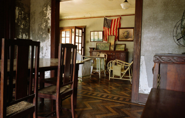 American flag hanging in the interior of a home