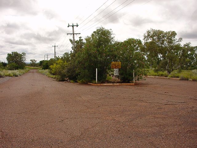 Traffic island in the middle of a dirt road