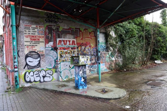 Graffiti-covered gas station in Doel