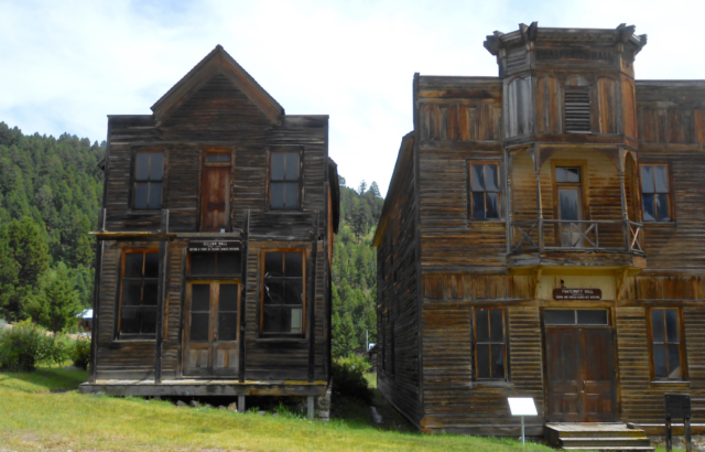 Two abandoned buildings stand side by side