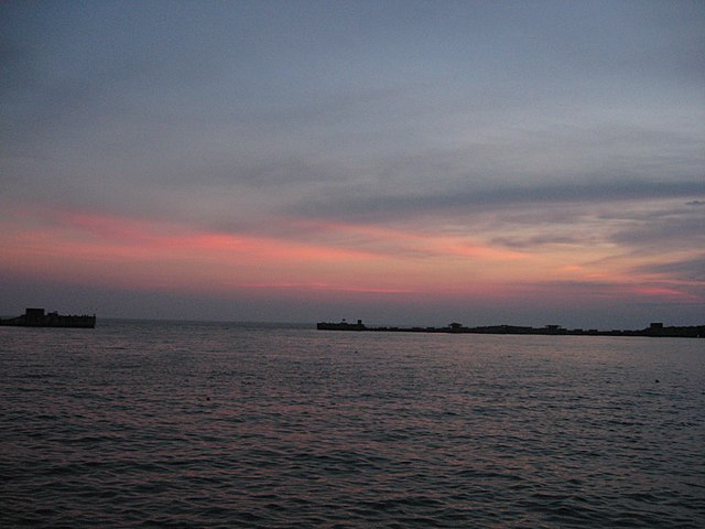 Sunset, with concrete ships in the distance
