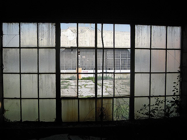 Looking at a window from the inside of a darkened building