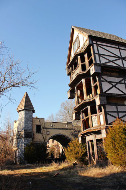 Building on stilts, surrounded by bushes