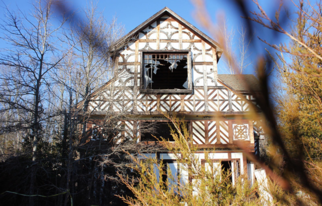 Exterior of a building with its windows smashed