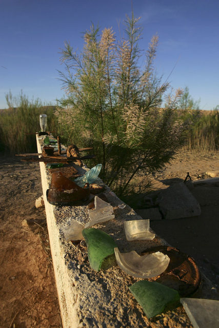 Artifacts lined up on a concrete block