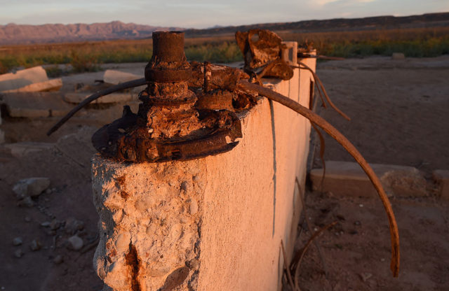 Rusty metal on top of a concrete block