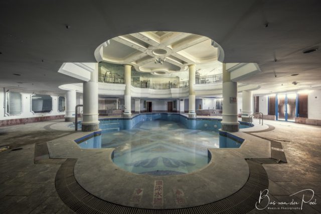 An abandoned indoor swimming pool.