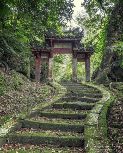 An old stone staircase leads to an oriental-style threshold.