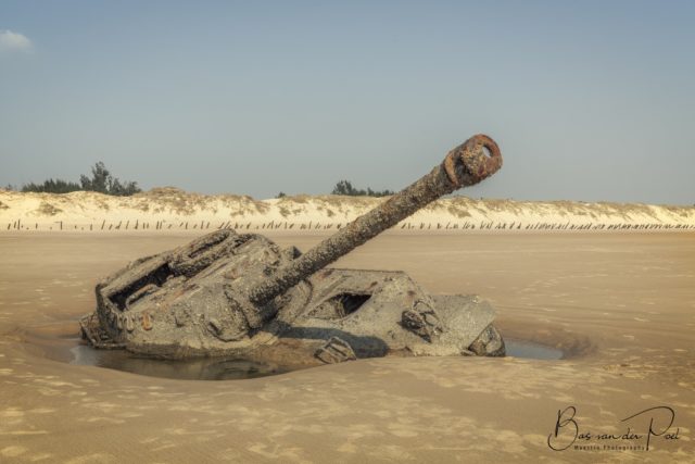 An abandoned tank sunken into the beach of Formosa. 