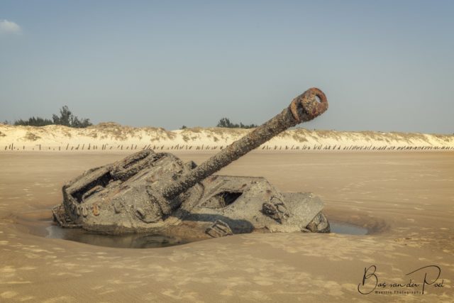 An abandoned tank sunken into the beach of Formosa.