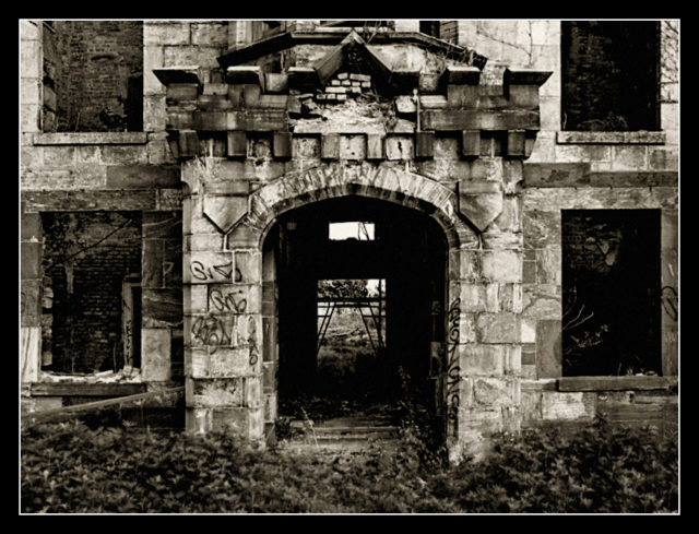 Graffitied doorway to Smallpox Hospital