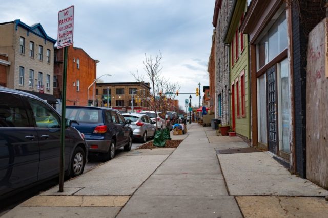 Cars parked along the side of a street