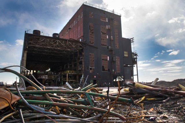 Pile of wire in front of an abandoned factory