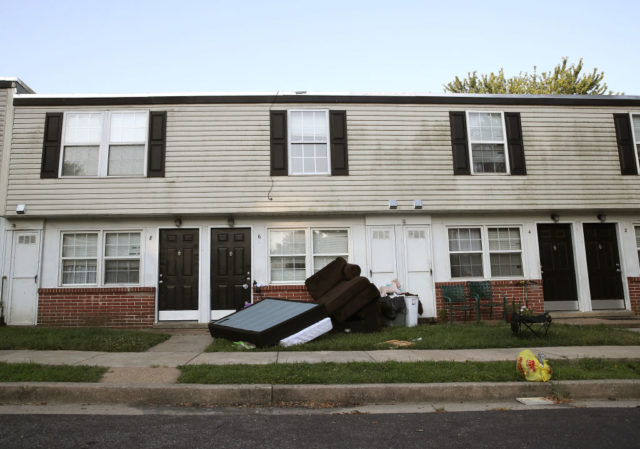 Furniture stacked outside of a house