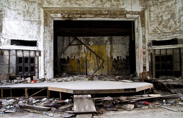 Wooden stage surrounded by debris