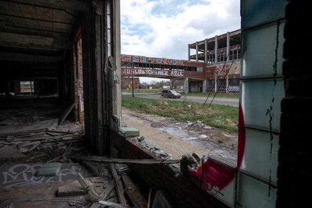 Looking outside from the interior of a decaying building