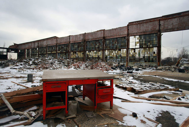 Red piano among snow and debris at the Packard Assembly Plant