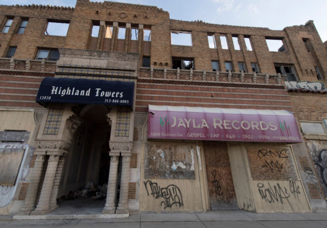 Exterior of a boarded-up commercial building