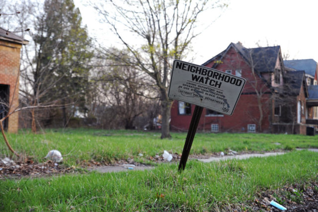 Neighborhood Watch sign stuck in the grass